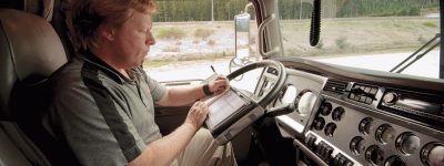Truck owner filling out job log