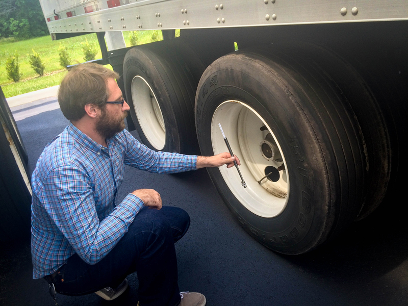 Status Trucks Tire Safety - Inspecting tire pressure
