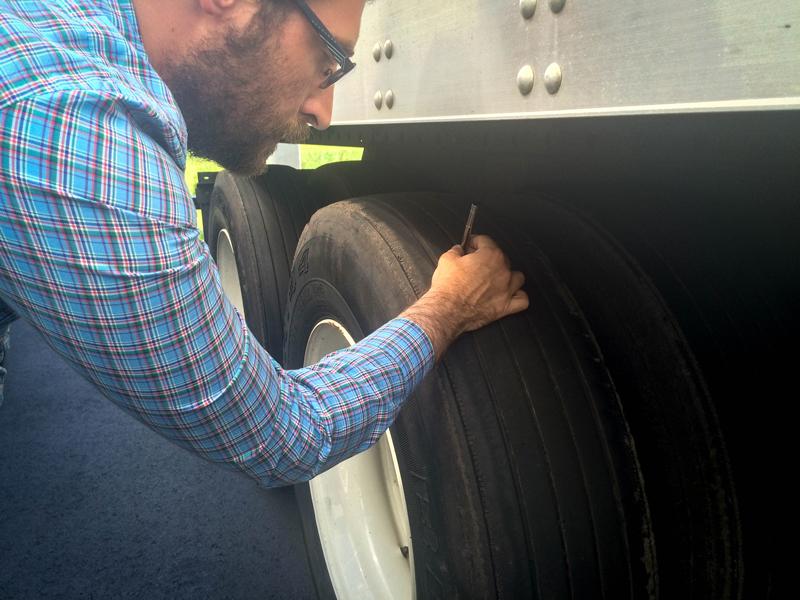 Status Trucks Tire Safety - Inspecting tire tread depth